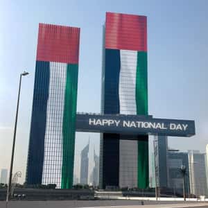Tower Glass Windows Flip Displaying Flag in a fake-out-of-home ad of BrandDubai