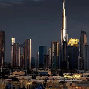 Crescent and Star Lights Hang on Windows in a fake-out-of-home ad of BrandDubai