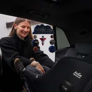 Fuzzy Planets Revolve Inside the Car in a fake-out-of-home ad of Joie Baby