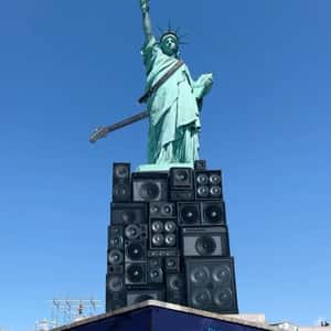Guitar Hangs on Statue of Liberty in a fake-out-of-home ad of Lenny Kravitz 