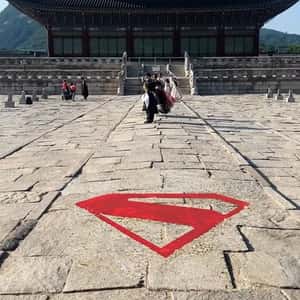 Logo Appears on Cobblestone Street in a fake-out-of-home ad of Superman