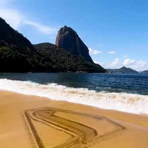Logo Formed by Waves on Sand in a fake-out-of-home ad of Superman