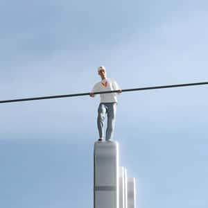 Man Pole Balancing on Smartphone in a fake-out-of-home ad of Verizon