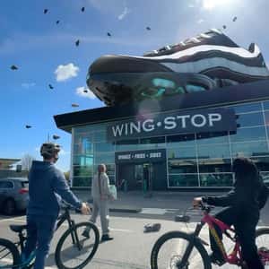 Raining Running Shoes in a fake-out-of-home ad of JD Sports