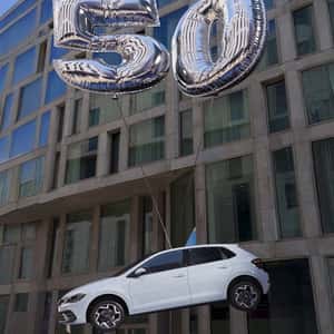 Car Floats with Number Balloon in a fake-out-of-home ad of Volkswagen