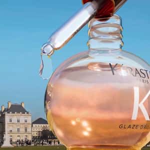 Roses Bloom with Hair Oil Drops in a fake-out-of-home ad of Kérastase