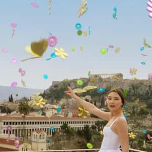 Flower Charms Fill the Sky in a fake-out-of-home ad of Anna Maria Mazaraki