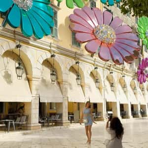 Flower Charms Shine on Façade in a fake-out-of-home ad of Anna Maria Mazaraki