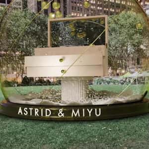 Golden Pearls Float on Snow Globe in a fake-out-of-home ad of Astrid & Miyu