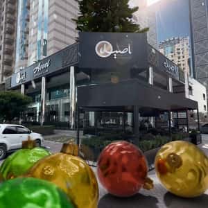 Christmas Balls Roll from Cafe in a fake-out-of-home ad of Aseel Restaurant & Cafe