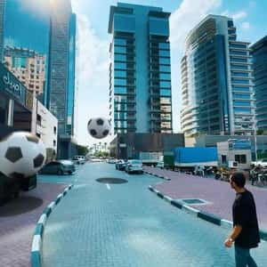 Soccer Balls Bouncing on Street in a fake-out-of-home ad of Aseel Restaurant