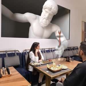Statue Hands Hookah on Table in a fake-out-of-home ad of Aseel Restaurant