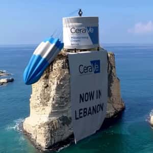 Cream on Parachute Lands on a Rock in a fake-out-of-home ad of CeraVe