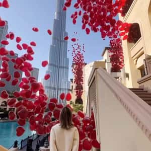 Heart Balloons Emerge from Windows in a fake-out-of-home ad of Burj Khalifa