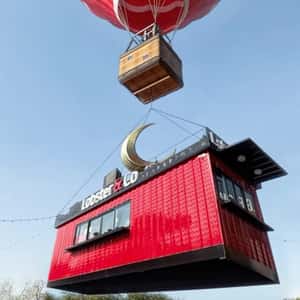 Hot Air Balloon Lifts Off Food Stall in a fake-out-of-home ad of Lobster & Co