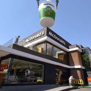 Helicopter Delivers Sunday at Rooftop in a fake-out-of-home ad on McDonald's