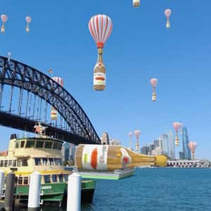 Wines on Parachute Float Above Bridge in a fake-out-of-home-ad of Pasqua