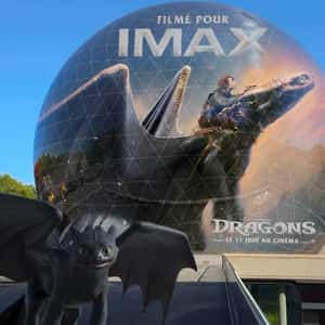Dragons Playing Near Spherical Building in a fake-out-of-home ad of Pathé France