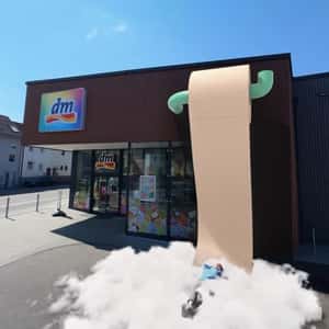 Man Sleeping on Clouds on Tissue Paper Clouds in a fake-out-of-home ad of DM