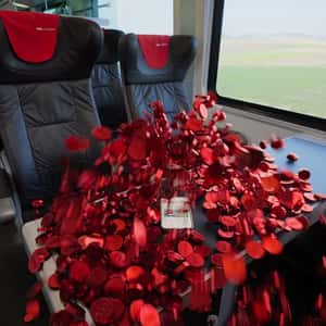 Red Coins Burst Out of the Phone in a fake-out-of-home ad of ÖBB