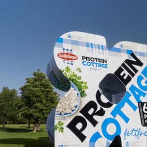 Man Jumps Through a Packaging in a fake-out-of-home ad of Schärdinger