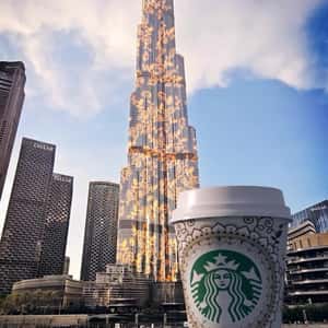 Coffee Cup with Mandala Tattoo in a fake-out-of-home ad of Starbucks