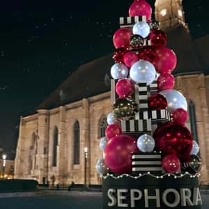 Christmas Tree Balls Towering at the Church in a fake-out-of-home ad of Sephora