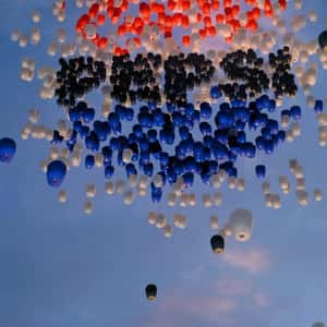 Sky Lanterns Forming Brand's Logo in a fake-out-of-home ad of Pepsi