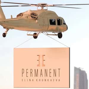 Giant Woman Groomed with Makeup in a fake-out-of-home ad of Elle Permanent