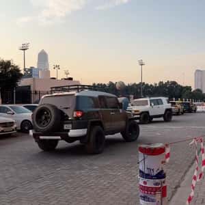 SUVs Playing Volleyball in a fake-out-of-home ad of automax