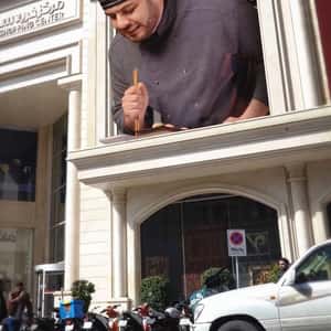 Chef Drops Sushi on Street in a fake-out-of-home ad of Azumi.ir