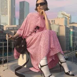Giant Model Poses at Roundabout in a fake-out-of-home ad of Balenciaga