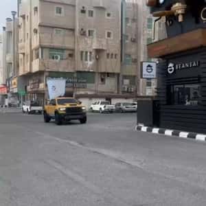 Crane Pours Coffee Beans in Machine in a fake-out-of-home ad of BEANSAI Cafe