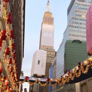 Luggage Moves on Conveyor at Times Square in a fake-out-of-home ad of BÉIS