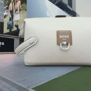 Golf Ball from Digital Screen Shoots on Bag in a fake-out-of-home ad of GQ