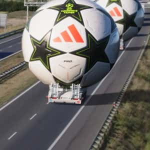 Trucks Transporting Footballs in a fake out of home ad of CANAL+