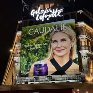 Shopping Center Glows in Purple in a fake-out-of-home ad of Caudalie