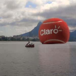 Red Tennis Ball Rolls on the Lake in a fake-out-of-home ad of Claro