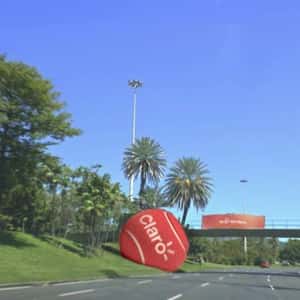 Red Tennis Ball Stuck on Footbridge in a fake-out-of-home ad of Claro