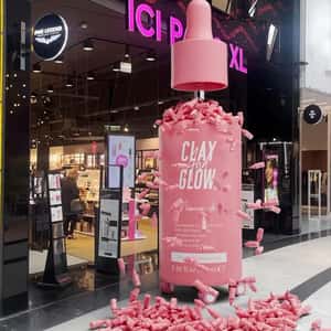 Serum on Wheels Drops Serum at Store in a fake-out-of-home ad of Clay and Glow
