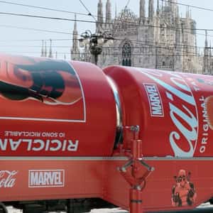 Deadpool-themed Cans on Tram in a fake-out-of-home ad of Coca-Cola