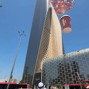 Balloons Lift a Coffee Cup in a fake-out-of-home ad of Costa Coffee