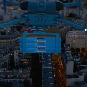 Drone Delivers Pizza at Stadium in a fake-put-of-home ad of Domino's Pizza