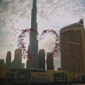 Red Balloons Form Heart in a fake-out-of-home ad of Dubai Mall
