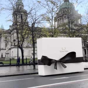 Gift Boxes Moving on Wheels in a fake-out-of-home ad of Dylan Oaks