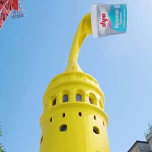 Crane Pours Paint on Tower in a fake-out-of-home ad of DYO