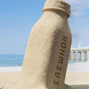 Bottle Sand Sculpture in a fake-out-of-home ad of Erewhon