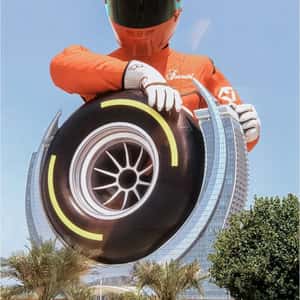 Racer Spins Wheel at Hotel in a fake-out-of-home ad of Fairmont Hotels & Resorts
