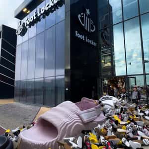 Slippers Spill from the Store in a fake-out-of-home ad of Foot Locker
