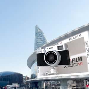 Camera Captures Shot from Facade in a fake-out-of-home ad of Fujifilm